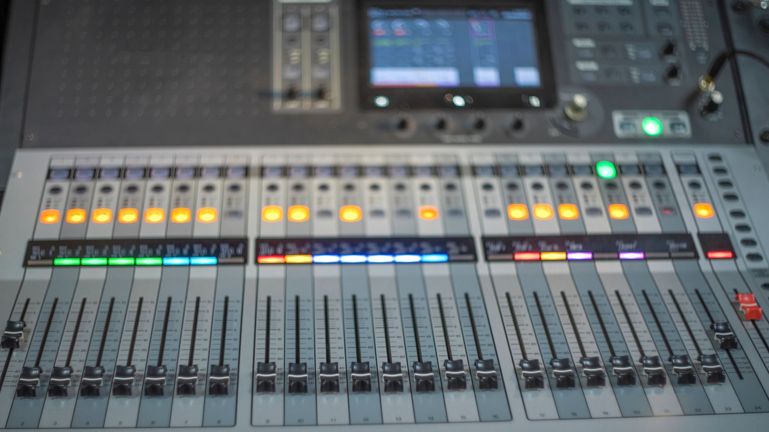 Professional digital audio mixer with illuminated controls